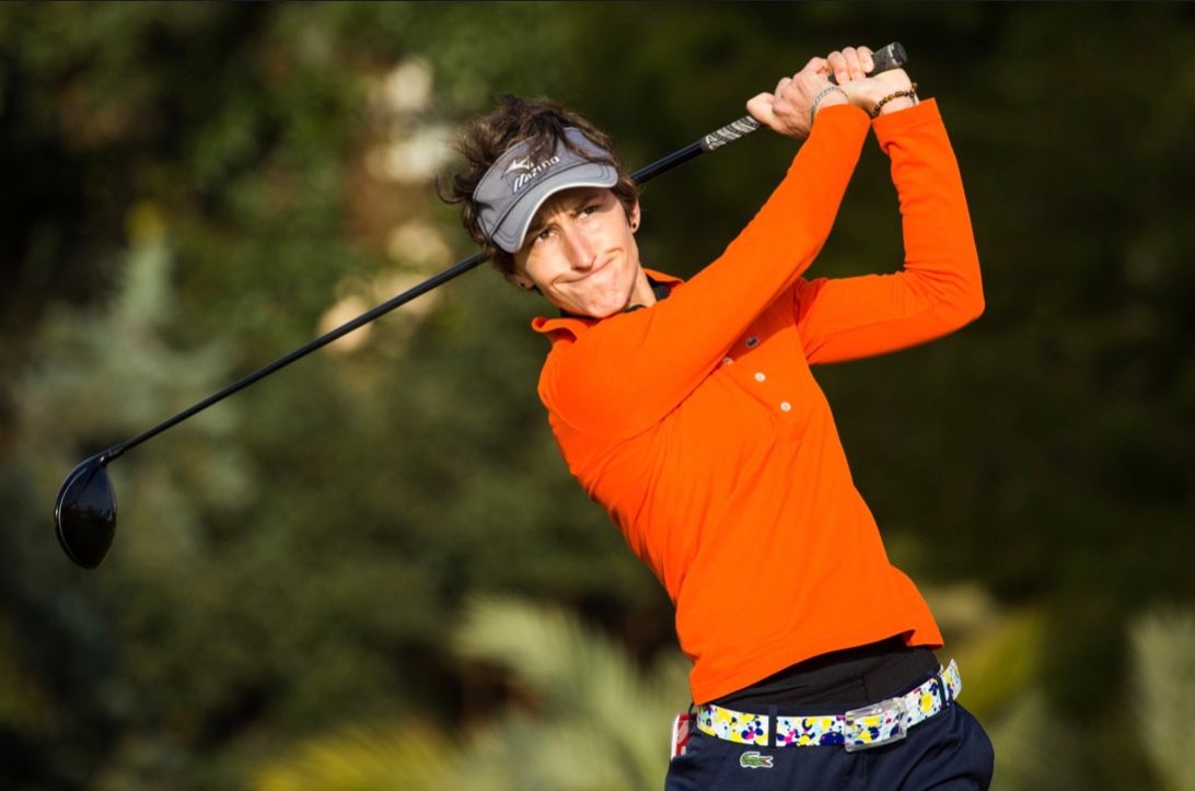 Female wearing a colourful skimp belt whilst playing golf