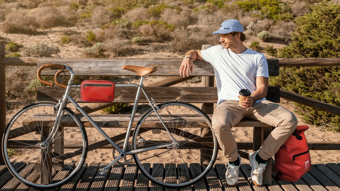 Red SKIMP Adventurer backpack on a cycling trip