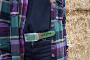 Khaki green SKIMP Originale belt worn with a check shirt