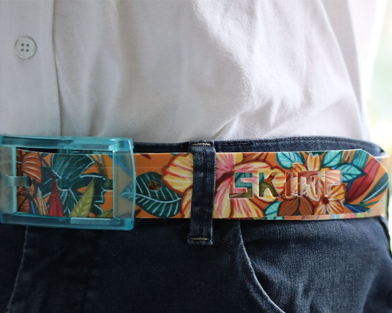 Close-up of the SKIMP Petite Lulu Tropical Belt floral print and cut-out SKIMP logo