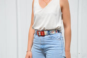SKIMP Zig Zag Belt with red buckle worn with high-waisted light denim jeans
